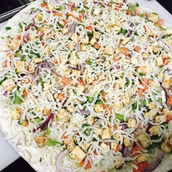 Magoo's Pizza - an uncooked uncooked pizza - Pizza Near Me - Bakersfield, California