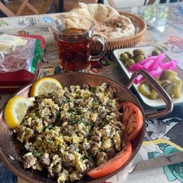 Eggs with meat and they give a free dish of pickled olives cucumbers and another one. Eggs with meat and they give a free dish of pickled olives cucumbers and another one.