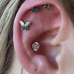 El Toro Body Shop- Tattoo & Body Piercing Studio - Client chose for a 4 gem butterfly for fresh helix piercing by Melissa and upgraded conch jewelry to 5mm gemWOW!
