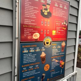a menu on the side of a building a menu on the side of a building