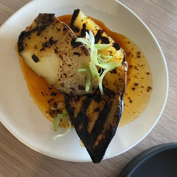 Owamni - Roasted sweater potato with chili oil and scallion - New American Near Me - Minneapolis, Minnesota