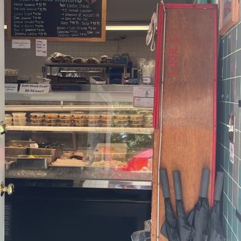 Alive & Kicking Lobsters - Merch wall, refrigerated display of prepared foods (coleslaw etc) and fresh seafood - Seafood Near Me - Cambridge, Massachusetts