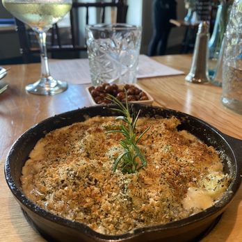 Agapi Bistro + Garden - Brussel Sprout Cassoulet with Neuske bacon and three cheese fondue and season bread crumbs - Mediterranean Near Me - Pensacola, Florida Agapi Bistro + Garden - Brussel Sprout Cassoulet with Neuske bacon and three cheese fondue and season bread crumbs - Mediterranean Near Me - Pensacola, Florida