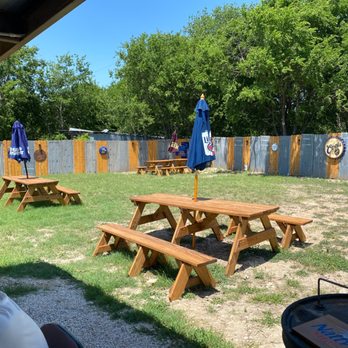 Texas Smokehaus BBQ - a man sitting at a picnic table - Barbeque Near Me - Temple, Texas