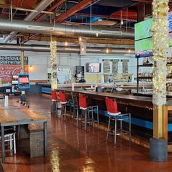 Smoke: Texas BBQ & Watering Hole - Looking back in from the perimeter, and you can see tables, the large square bar, and a roomy vibe from the open ceiling