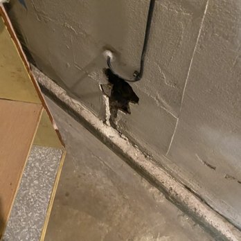 Aspire Construction - Stucco area in the garage needs patching also 4 smoke alarms and panel needs attachment - General Contractors Near Me