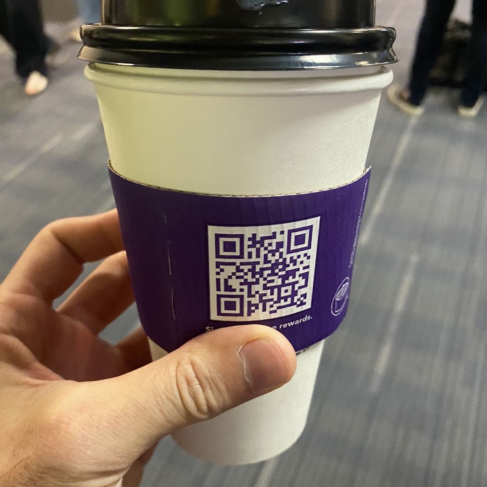 Coffee Bean & Tea Leaf - a hand holding a cup of coffee - Coffee & Tea Near Me - Los Angeles, California