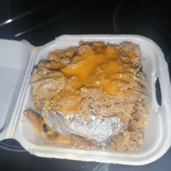 Cowboy's BBQ - Pulled Pork Stuffed Baked Potato. Toppings can be customized.