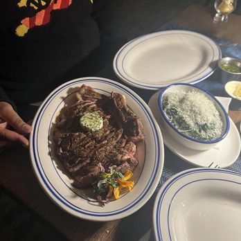 Wicked Butcher - Cowboy ribeye with Herb Butter (sliced for sharing)  Creamed Spinach - Steakhouses Near Me - Dallas, Texas