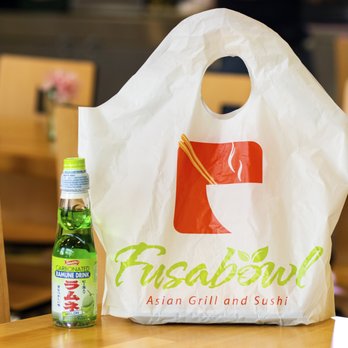 Fusabowl - a plastic bag and a bottle on a table - Asian Fusion Near Me - Cincinnati, Ohio