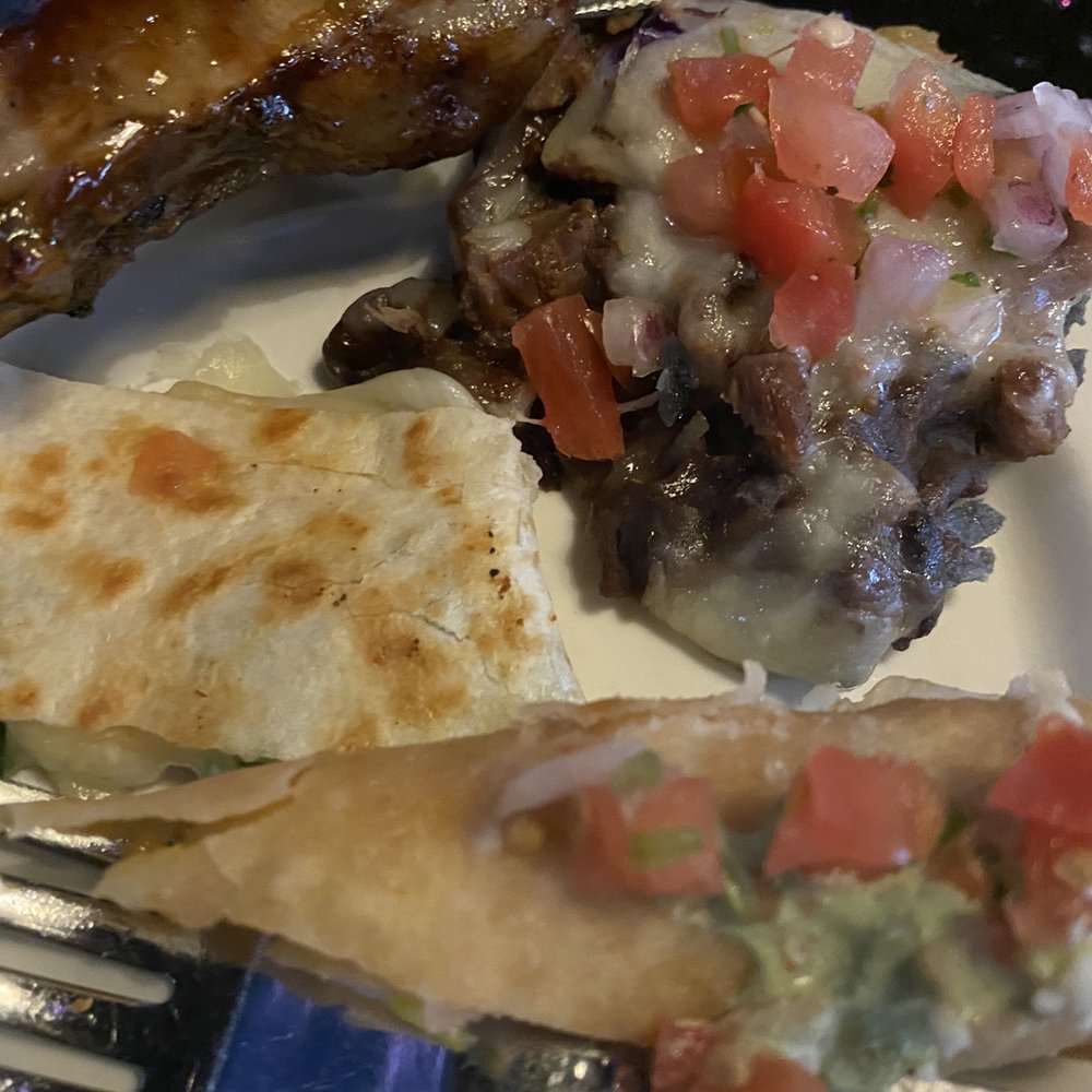 Sinigual - From the appetizer platter: Chicken Taquitos, Cheese Quesadilla, carne asada nachos and ribs - Mexican Near Me - Manhattan, New York Sinigual - From the appetizer platter: Chicken Taquitos, Cheese Quesadilla, carne asada nachos and ribs - Mexican Near Me - Manhattan, New York