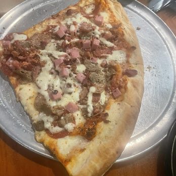 Broomelli Boys Pizzeria - Meat lovers pizza (the individual slices were pretty cheap and portions were large) - Pizza Near Me - Brunswick, Georgia Broomelli Boys Pizzeria - Meat lovers pizza (the individual slices were pretty cheap and portions were large) - Pizza Near Me - Brunswick, Georgia
