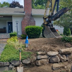 Hawk Brook Construction - Restored lawn, returned plantings, and rebuilt stone wall.