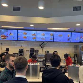 Chick-fil-A - Busy counter with customers waiting for their order. - Fast Food Near Me - New York, New York Chick-fil-A - Busy counter with customers waiting for their order. - Fast Food Near Me - New York, New York