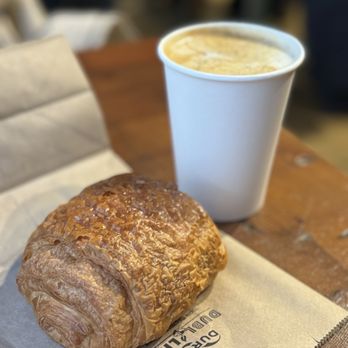 Elixr Coffee Roasters - Caramel Black Salt Latte and chocolate croissant - Coffee Roasteries Near Me - Philadelphia, Pennsylvania