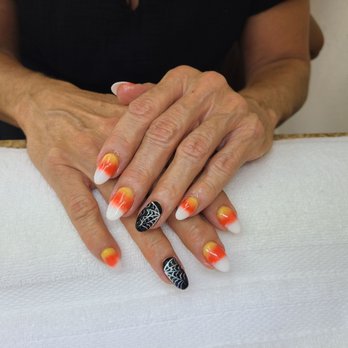 Crystal Nails - Candy corn nails with web accents. - Nail Salons Near Me - Pasadena, California
