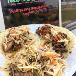 three tacos on a paper plate three tacos on a paper plate