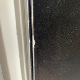 Damage to front door because movers wouldn't even consider removing the door for a larger order.