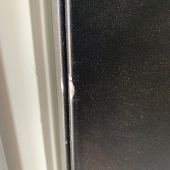 Ashley Store - Damage to front door because movers wouldn't even consider removing the door for a larger order. - Furniture Stores Near Me - Modesto, California