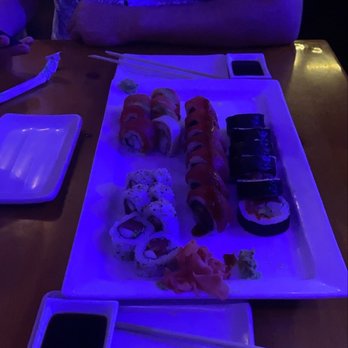 Sushi Rock - Spicy tuna roll (bottom left), Rainbow roll with Alaskan snow crab (top left) Red Hot Chili Peppers roll (middle), Sushi Rock roll (right). - Sushi Bars Near Me - Pinecrest, Florida