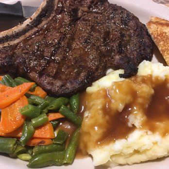 Holiday Restaurant - Flamed grilled Ribeye Steak, mashed potatoes & veggies. It was the lunch special for $12.99, including the soup & salad bar. - American Near Me - Zapata, Texas Holiday Restaurant - Flamed grilled Ribeye Steak, mashed potatoes & veggies. It was the lunch special for $12.99, including the soup & salad bar. - American Near Me - Zapata, Texas