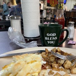 Cheryl's Diner - Biscuit, bacon, and eggs, fried potatoes