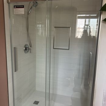 JV Construction - removed old shower insert, moved drain location, put in tile and shower ledge, raised shower head - General Contractors Near Me JV Construction - removed old shower insert, moved drain location, put in tile and shower ledge, raised shower head - General Contractors Near Me