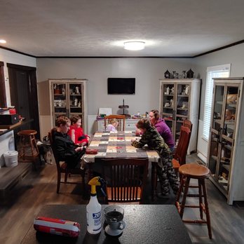 Fred's Flooring - people sitting at a kitchen table - Flooring Near Me - Murfreesboro, Tennessee