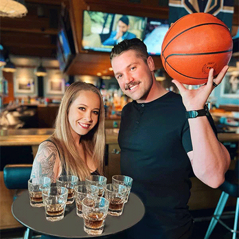 PT's Pub - a man and a woman holding a basketball - Pubs Near Me - Las Vegas, Nevada PT's Pub - a man and a woman holding a basketball - Pubs Near Me - Las Vegas, Nevada