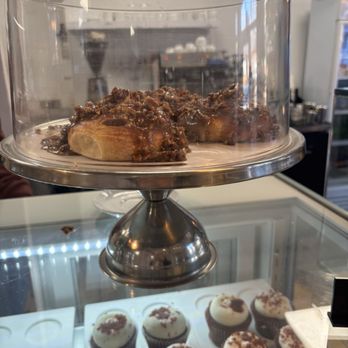 Dulce Bakery and Cafe - Cinnamon roll topped with pecans. - Cafes Near Me - Columbia, South Carolina