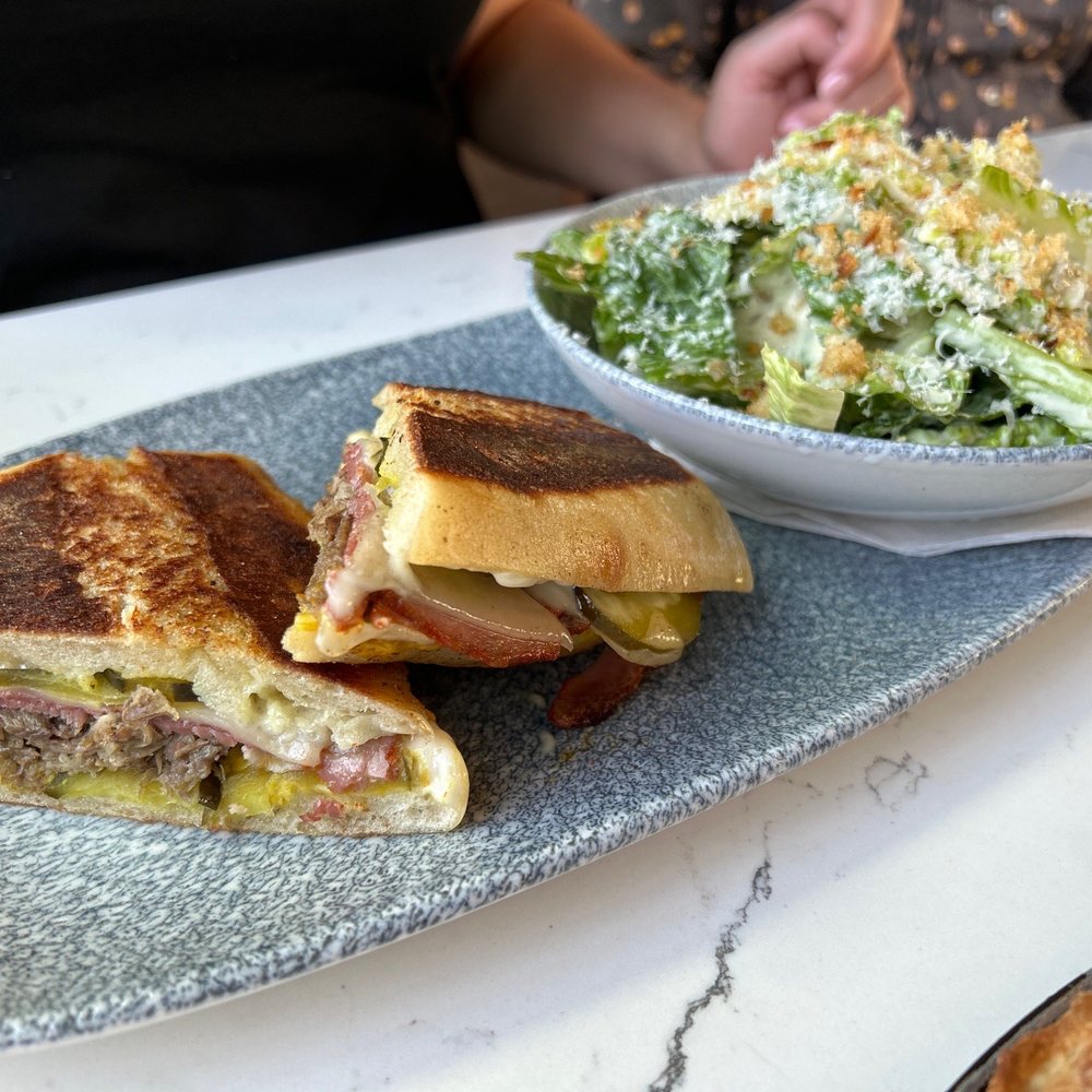 The Table Bistro - Duck sando with Caesar salad - Bistros Near Me - Abbotsford, British Columbia The Table Bistro - Duck sando with Caesar salad - Bistros Near Me - Abbotsford, British Columbia