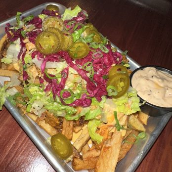 Cob & Pen - Ultimate Fries - toppings change weekly!  Pictured: beer cheese, pulled pork, cabbage, jalapeños & a side of c&p sauce - Beer Bar Near Me - Lakeland, Florida