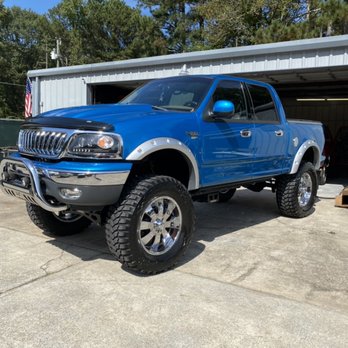 Harley Collision Centers - Big Blue. Customer wanted his fender flares painted to match his 4x4 emblems on the bed sides. We obliged! Yes, it's as big as it looks! - Body Shops Near Me - Covington, Georgia