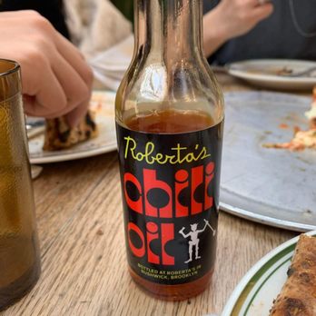Roberta's - Complementary chili oil - yum! Add it to your pizza! Not too spicy. - Pizza Near Me - Brooklyn, New York Roberta's - Complementary chili oil - yum! Add it to your pizza! Not too spicy. - Pizza Near Me - Brooklyn, New York