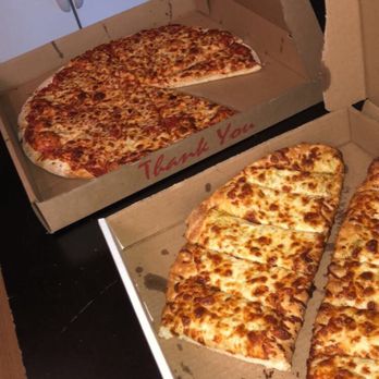 My Pizza Express - Left is a large pizza and the right is two servings of cheesy garlic bread. Both delicious. - Pizza Near Me - Kitchener, Ontario My Pizza Express - Left is a large pizza and the right is two servings of cheesy garlic bread. Both delicious. - Pizza Near Me - Kitchener, Ontario