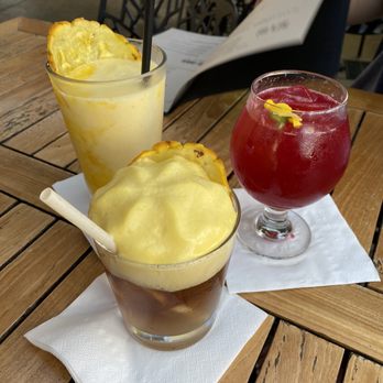 Monkeypod Kitchen - Mango smoothie in the back, blind Tiger in the red, and monkeypod mai tai in the front - Hawaiian Near Me - Kapolei, Hawaii