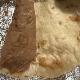 Pasty and dry refried beans from their bean and cheese taco. Pasty and dry refried beans from their bean and cheese taco.