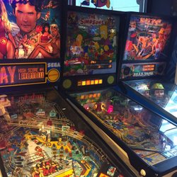 Pinball row. Only three machines. Only one is in proper working order. None are set for free play.