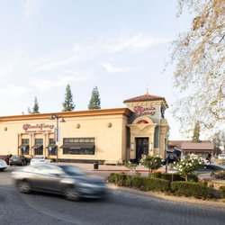Fashion Fair Mall - Exterior of The Cheesecake Factory at Fashion Fair with cars passing in front.