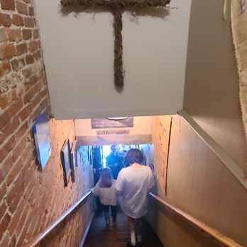Appalachian Java Cafe & Desserts - a person walking down a stairway - Coffee & Tea Near Me - Burnsville, North Carolina