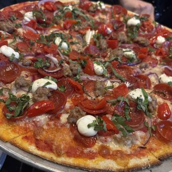 Pizza Rock - Cracker thin Chicagoland pizza.  They drizzle honey on this pizza so be aware of that! - Pizza Near Me - Las Vegas, Nevada
