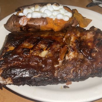 Texas Roadhouse - Half rack of ribs and a baked sweet potato loaded with toasted marshmallows & caramel sauce - American Near Me - Bowie, Maryland