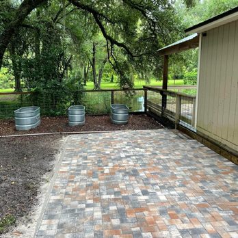 Outdoor professions - a patio area with pavers and barrels - Lawn Services Near Me - Eustis, Florida Outdoor professions - a patio area with pavers and barrels - Lawn Services Near Me - Eustis, Florida