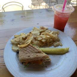 Half Vegetarian Panini with chips, pickle and a Cherry Italian soda Half Vegetarian Panini with chips, pickle and a Cherry Italian soda