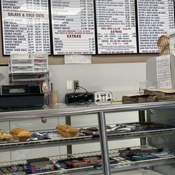 Bagels and More - Old school signage and assorted snacks and desserts