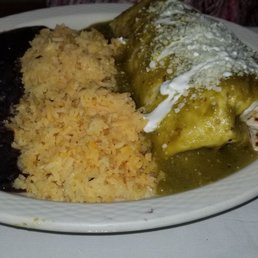 Vegetable burrito dipped with green sauce Vegetable burrito dipped with green sauce