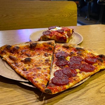 Scarr's Pizza - Plain and Pepperoni thin-crust slices (front) and Pepperoni Sicilian (back) slices - Pizza Near Me - New York, New York Scarr's Pizza - Plain and Pepperoni thin-crust slices (front) and Pepperoni Sicilian (back) slices - Pizza Near Me - New York, New York