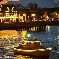 Tiny Tug Tours - View of the boat lit for Nights of Lights