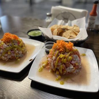 Mariscos Prendidos - two plates of food on a table - Seafood Near Me - Long Beach, California Mariscos Prendidos - two plates of food on a table - Seafood Near Me - Long Beach, California