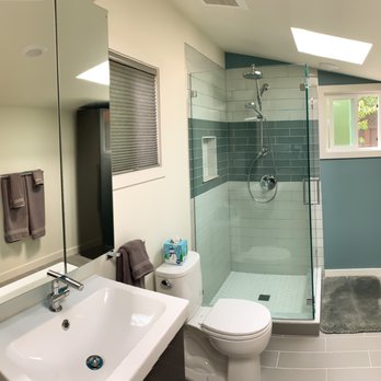 The Handyjew - a bathroom with a toilet, sink, and shower - General Contractors Near Me The Handyjew - a bathroom with a toilet, sink, and shower - General Contractors Near Me